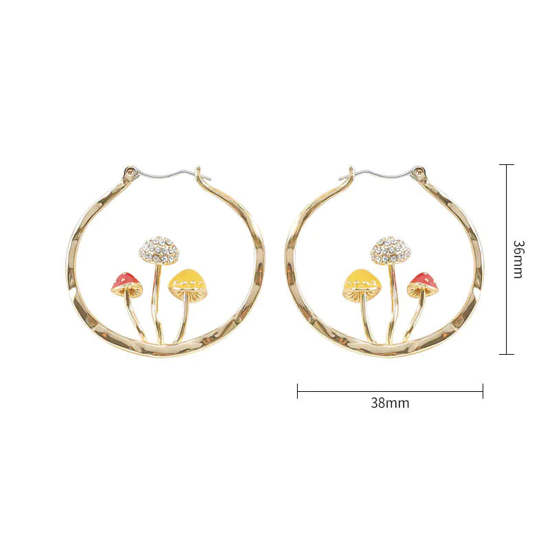Gold hoop earrings with mushroom designs and measurements on a white background