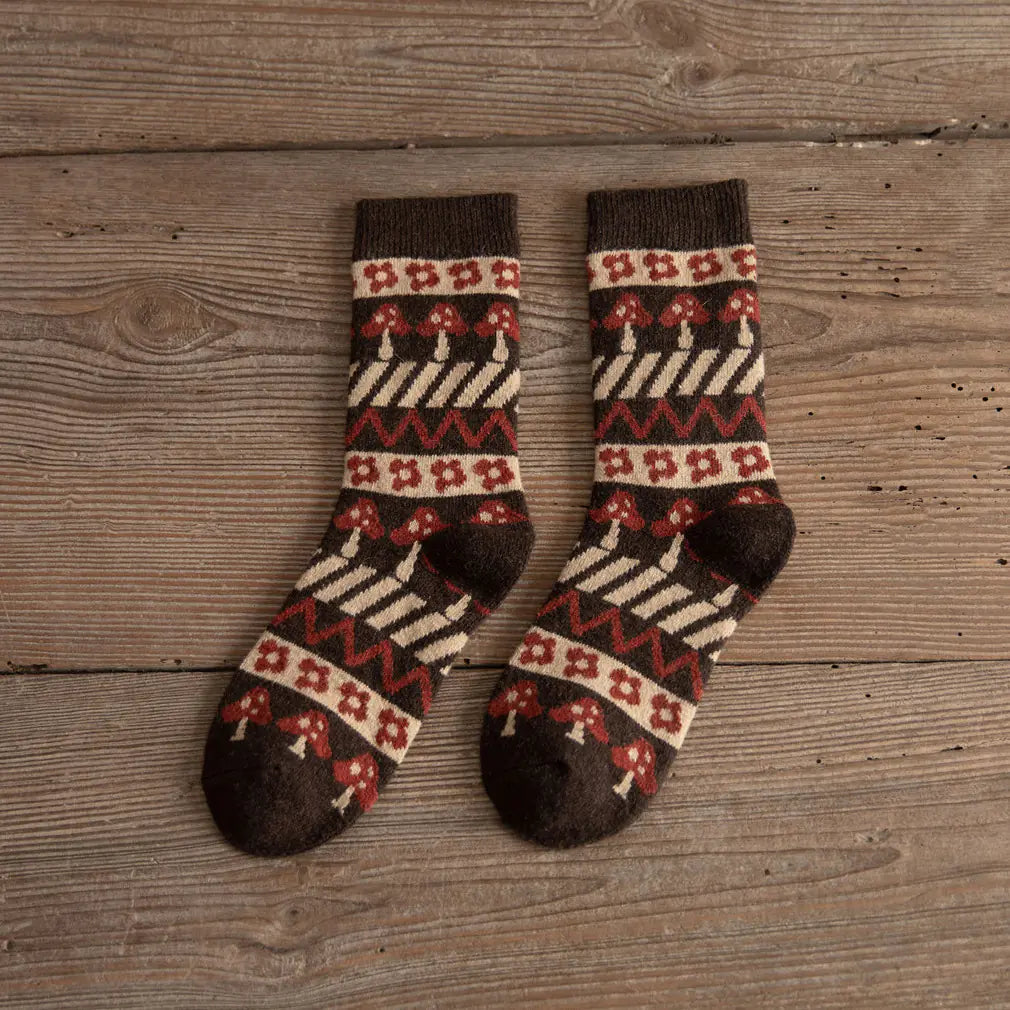 Pair of patterned socks on a wooden surface