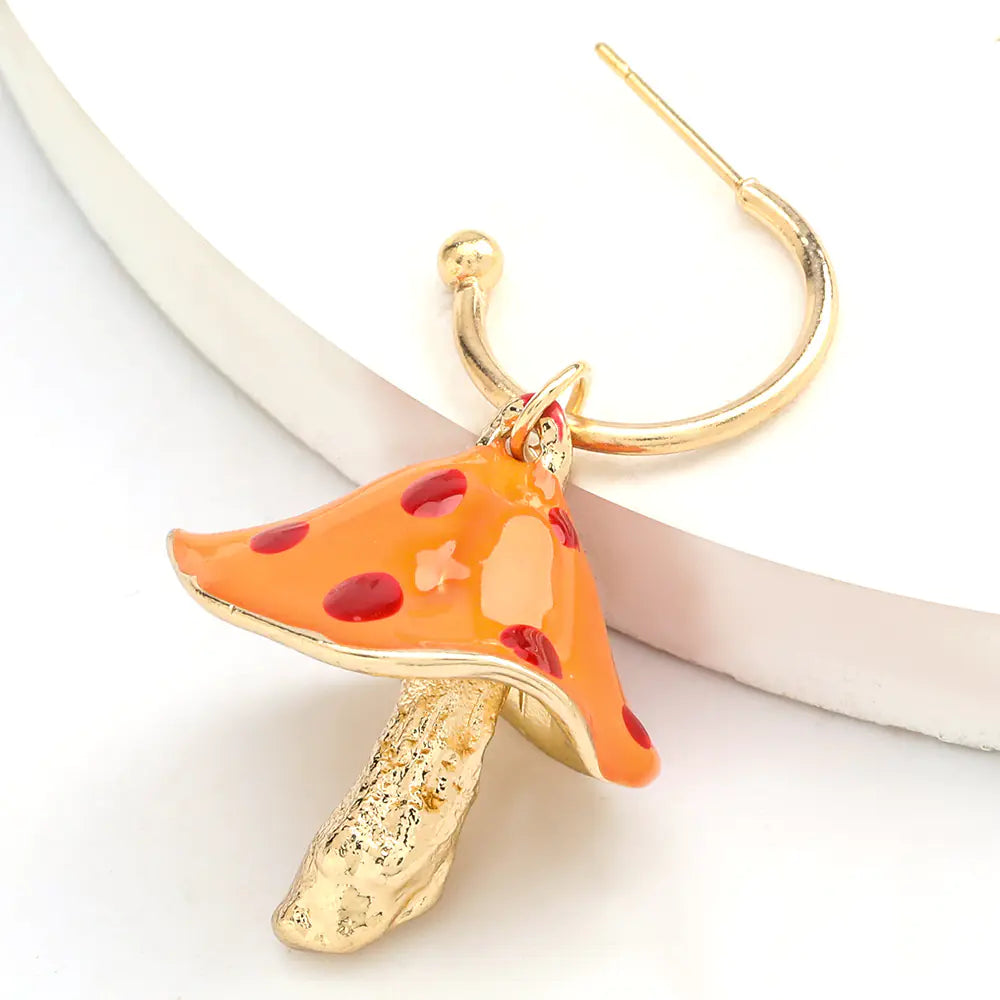 Pizza slice earring with gold hoop on a white background