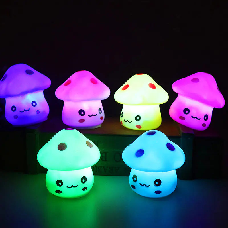 Colorful mushroom-shaped lights with cartoon faces on a dark background