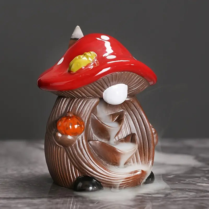Ceramic gnome figurine with a red mushroom hat on a dark background