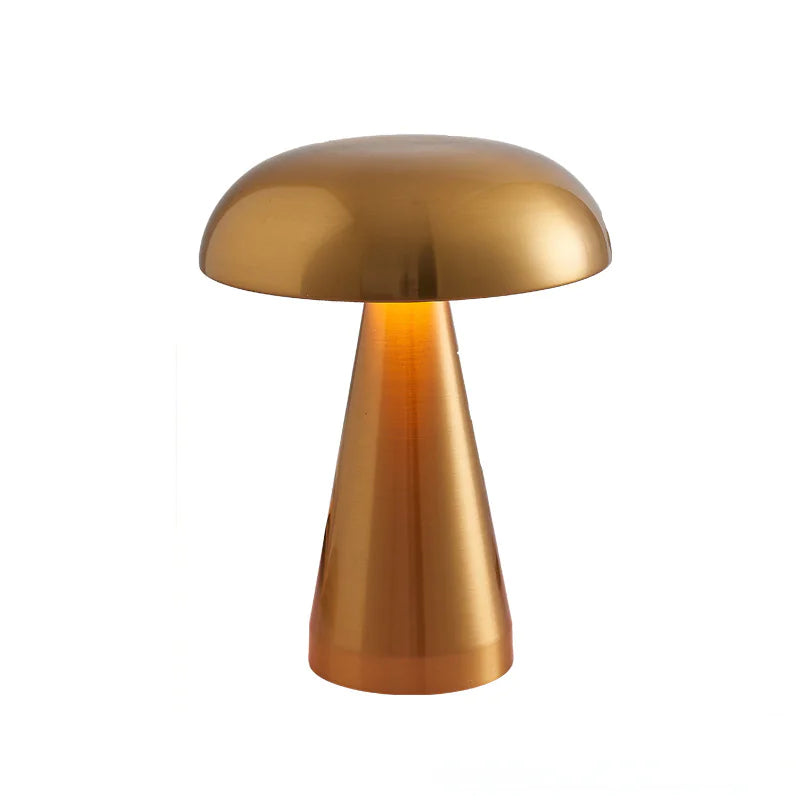 Gold table lamp with a white background