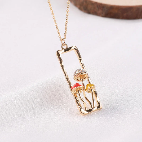 Necklace with a pendant featuring three colorful mushrooms on a white background