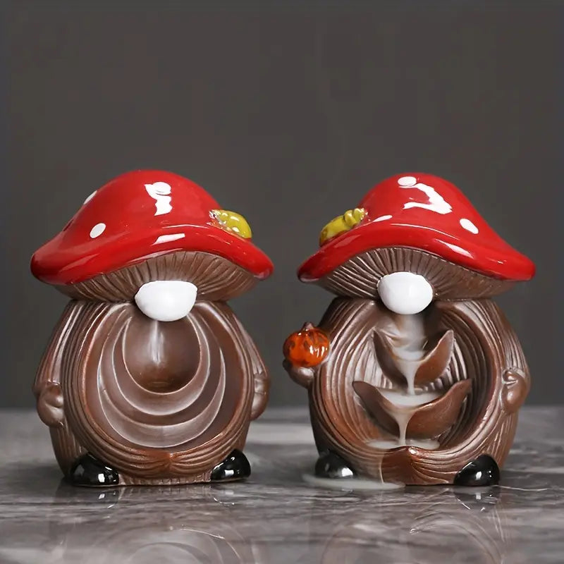Two mushroom-shaped figurines with red caps and brown bodies on a dark background