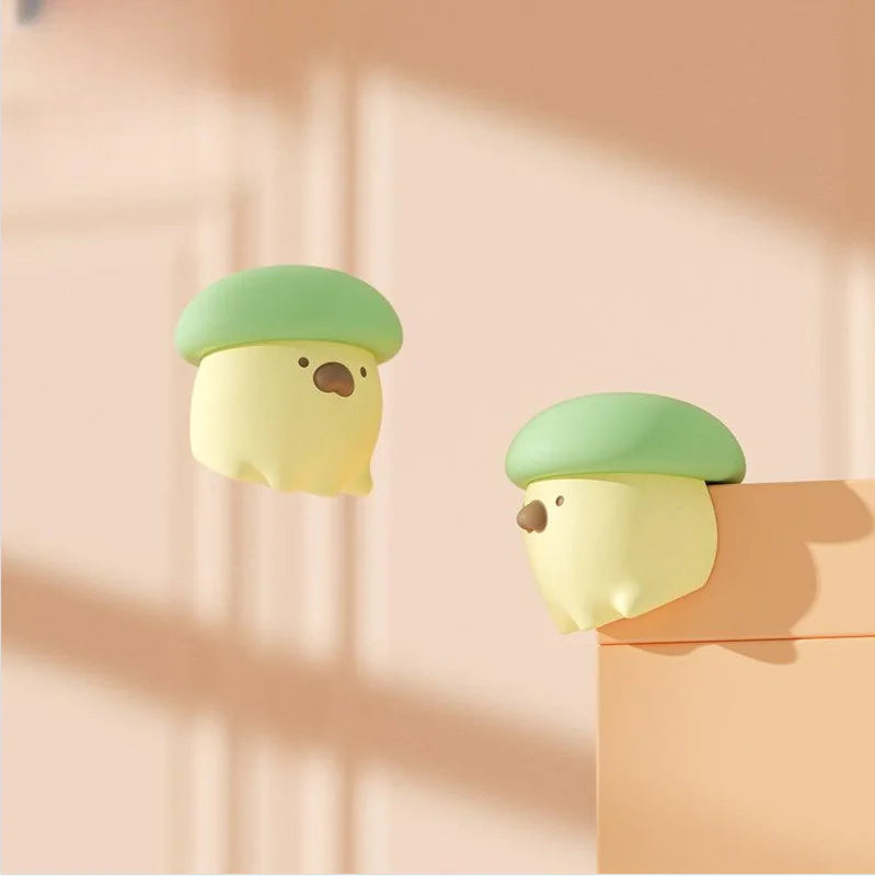 Two cartoon-style bird characters with green hats on a peach background