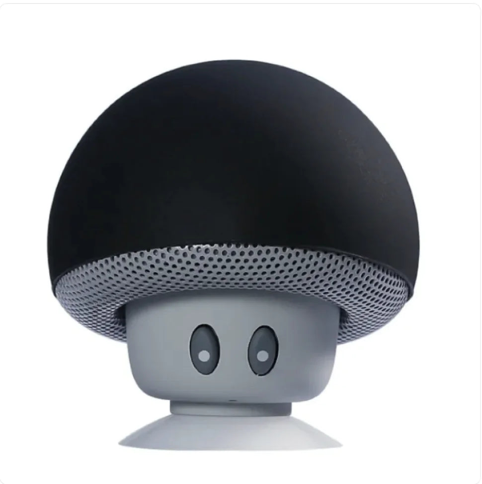 Black and gray mushroom-shaped speaker on a white background