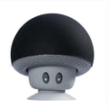 Black and gray mushroom-shaped speaker on a white background