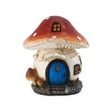 Mushroom-shaped fairy house with a blue door on a white background