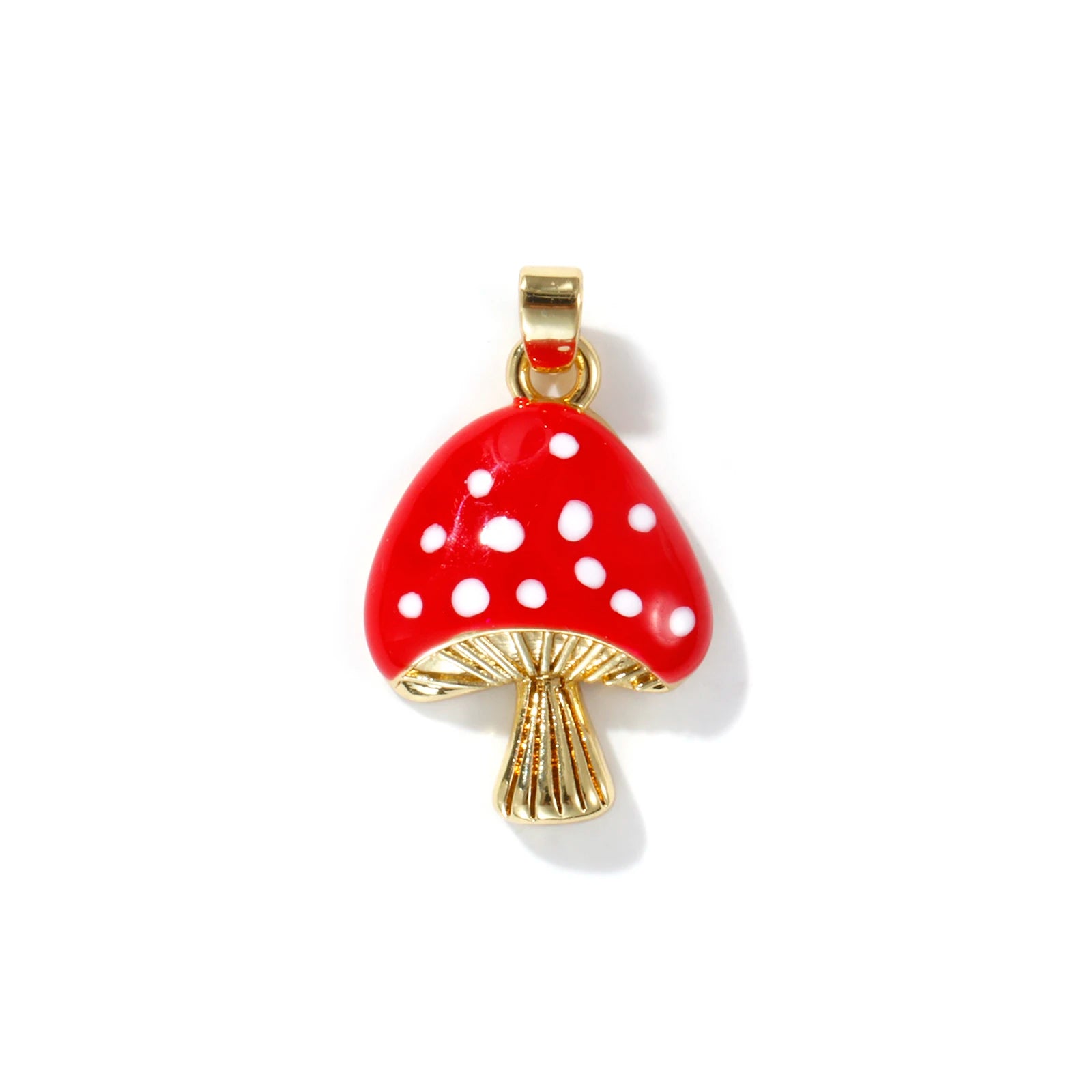 Red mushroom-shaped pendant with white spots on a white background