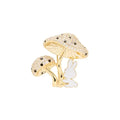 Gold mushroom-shaped ring with a white rabbit figure on a white background
