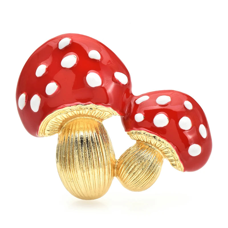 Red mushroom-shaped earrings with white spots on a white background