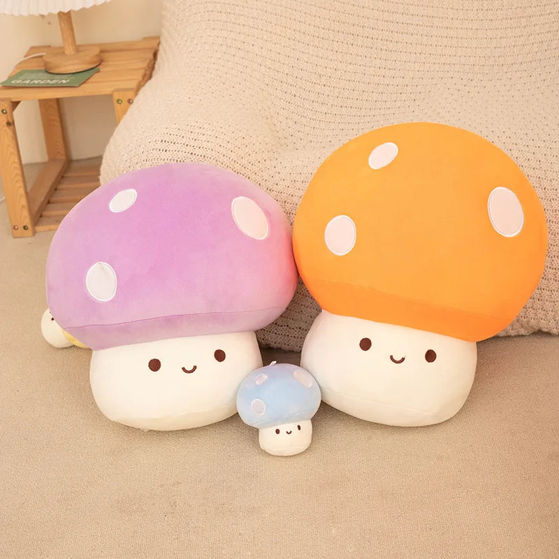 Set of mushroom-shaped plush toys in various colors on a beige surface.