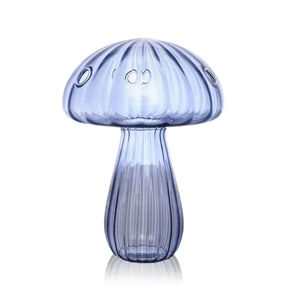 Blue glass mushroom-shaped lamp on a white background