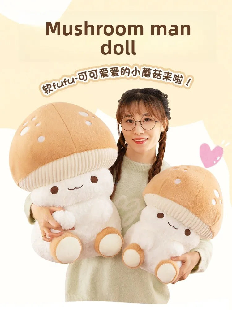 Person holding two mushroom-shaped plush toys with text 'Mushroom man doll' on a light background