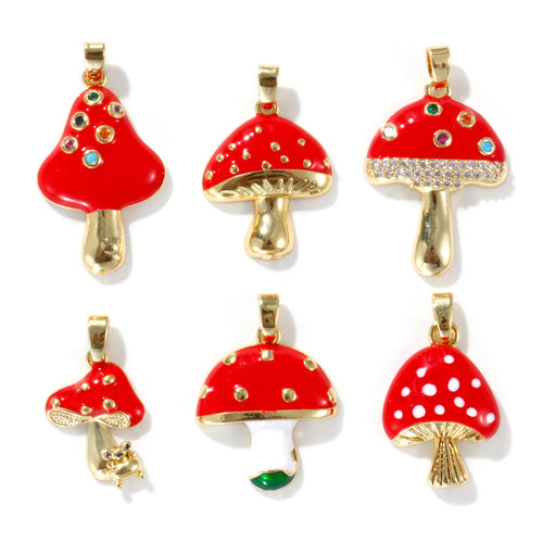 Set of red mushroom-shaped pendants with gold bases on a white background