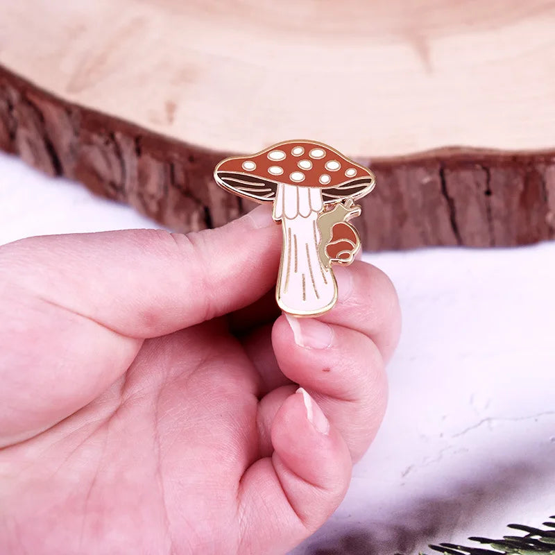 Mushroom-shaped pin held between fingers against a wooden background