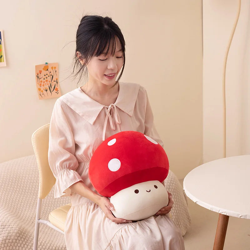 Woman holding a plush mushroom toy in a cozy room.