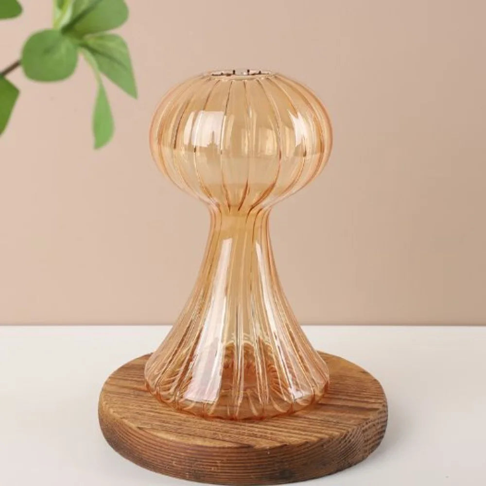 Decorative glass lamp with wooden base on a neutral background