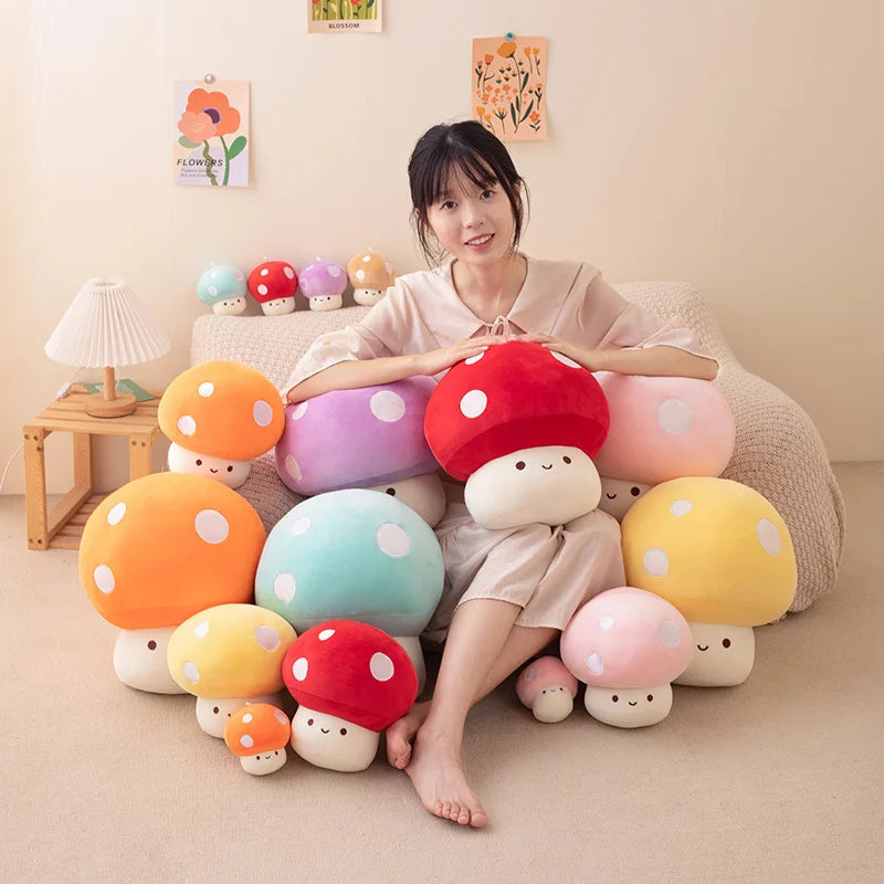 Woman sitting on a couch surrounded by colorful mushroom-shaped plush toys in a cozy room.