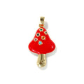 Red mushroom-shaped pendant with gold base and gemstones on a white background
