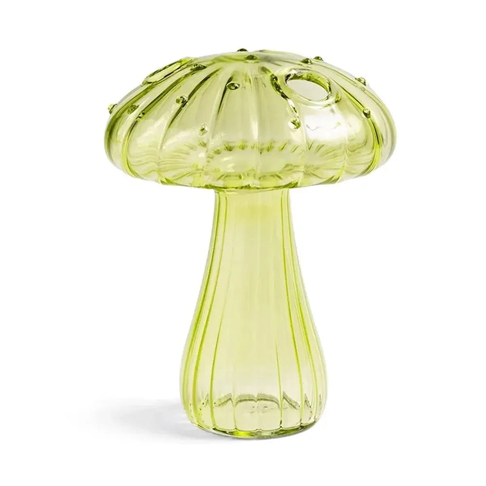 Clear yellow glass mushroom-shaped object on a white background