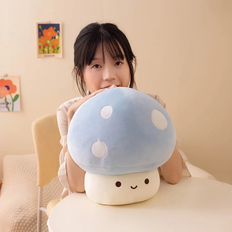 Person holding a plush mushroom toy in a cozy room.