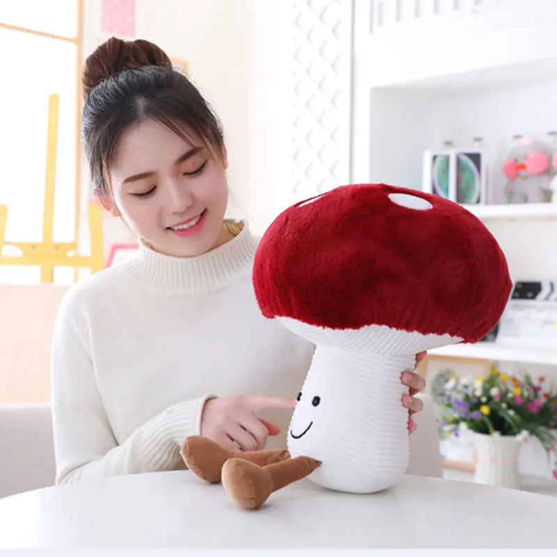 Woman holding a plush mushroom toy in a bright room