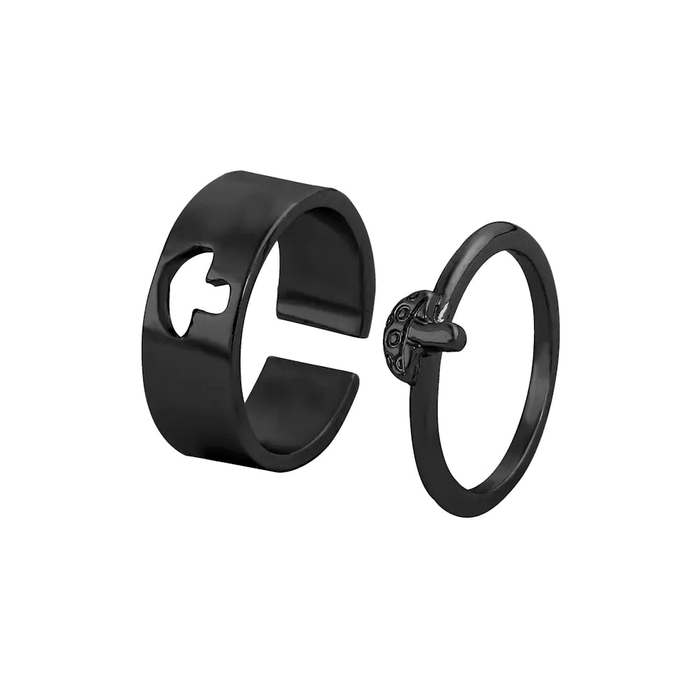 Black ring and black earring on a white background