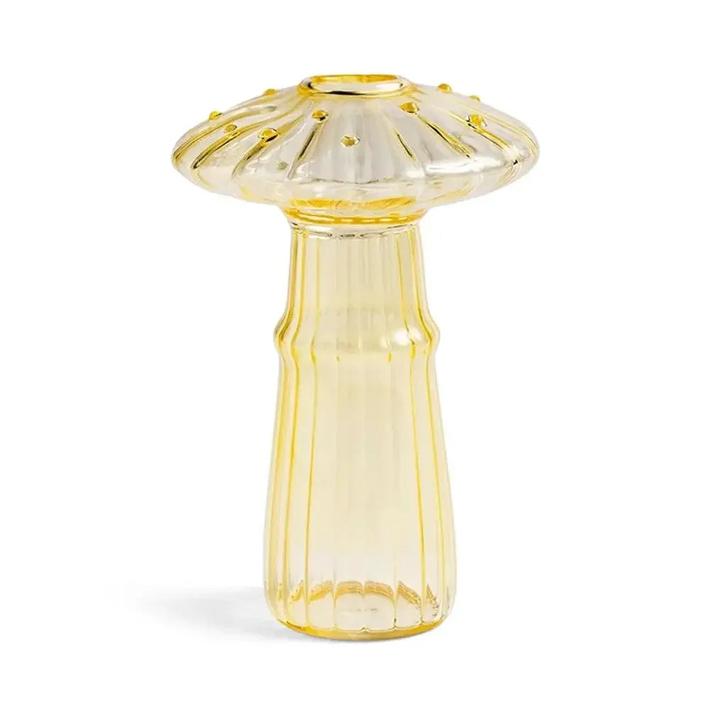 Yellow glass vase with gold accents on a white background