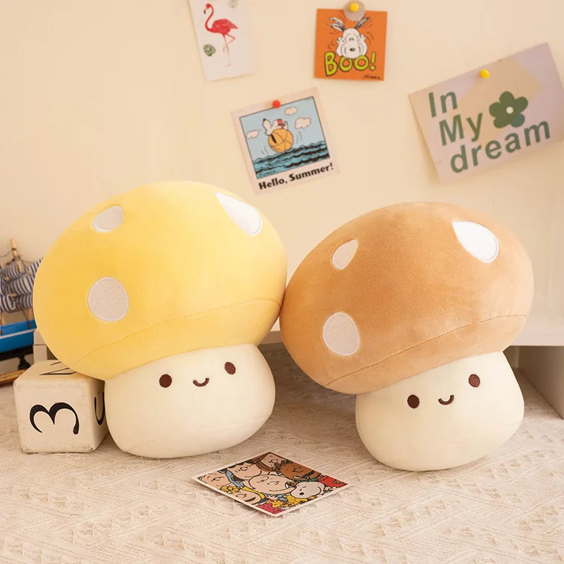 Two plush mushroom toys on a floor with decorative cards in the background.