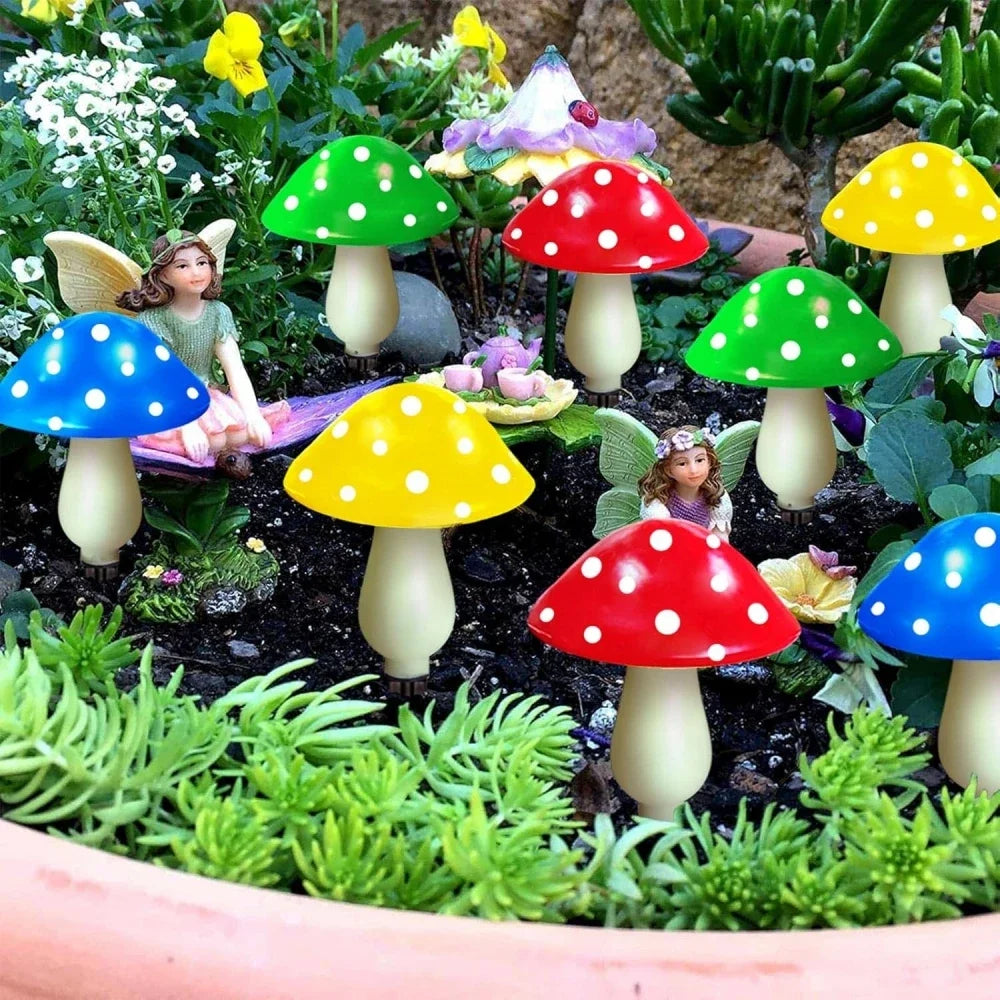 Colorful mushroom figurines with polka dots in a garden setting