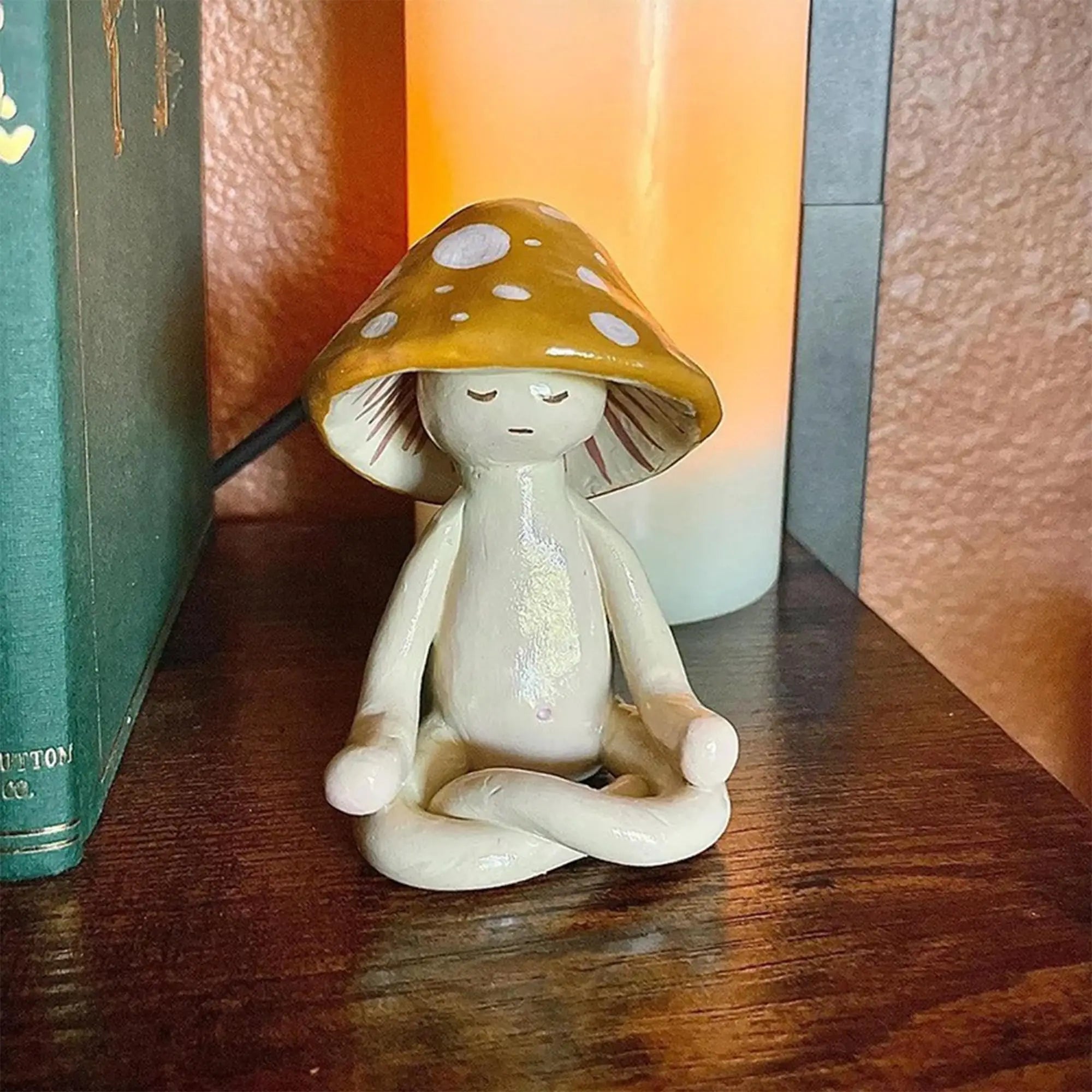 Small figurine with a mushroom hat on a wooden surface
