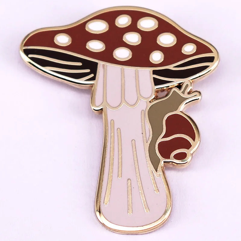 Mushroom-shaped enamel pin with a white background
