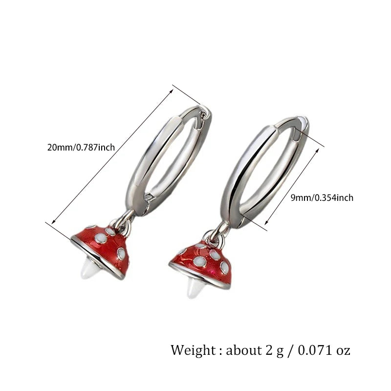 Silver hoop earrings with red mushroom charms, shown with measurements on a white background.