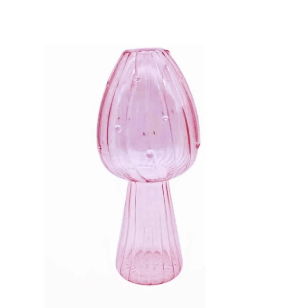 Pink glass vase on a white background
