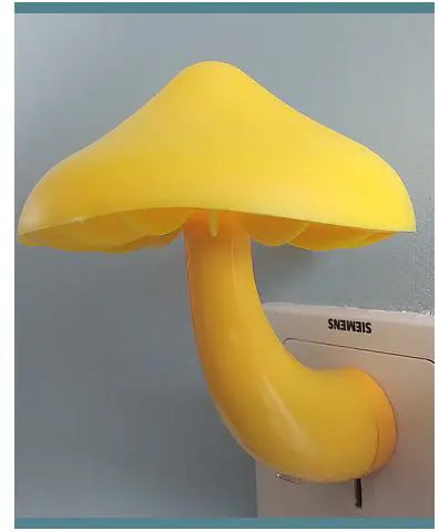 Yellow mushroom-shaped lamp attached to a wall socket with a Siemens logo.