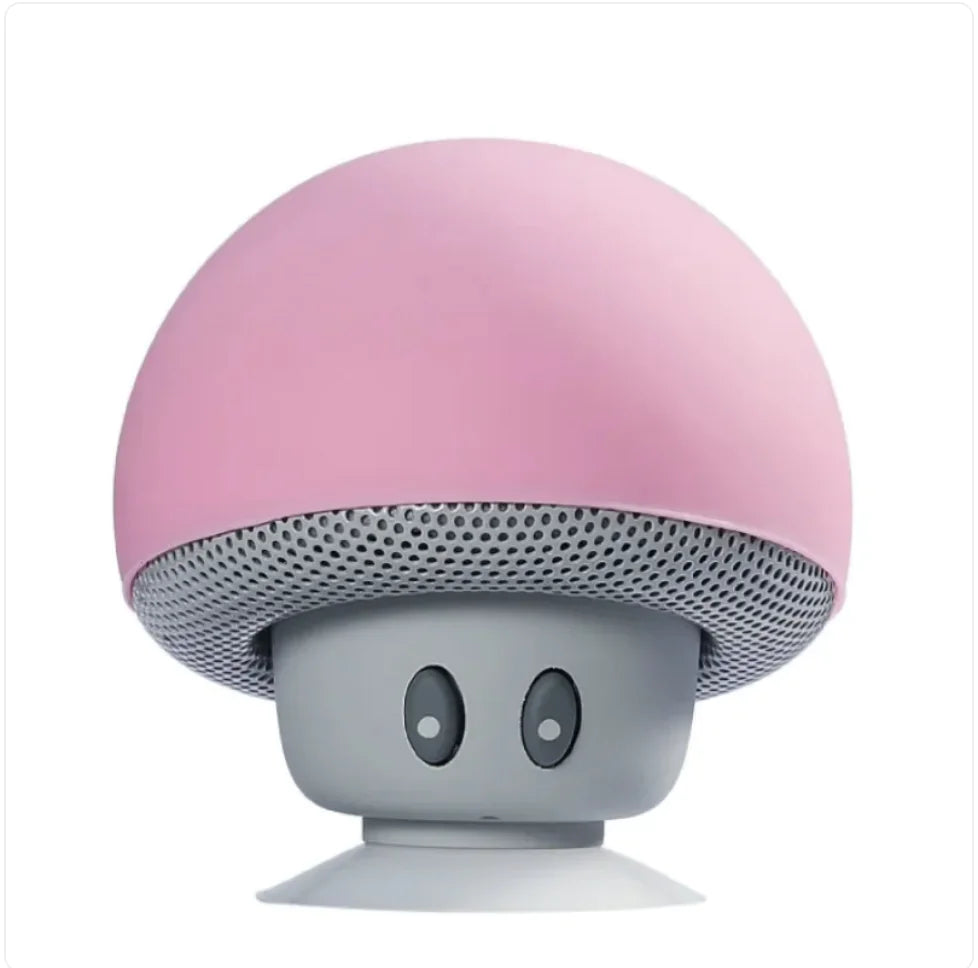 Pink and gray mushroom-shaped speaker on a white background