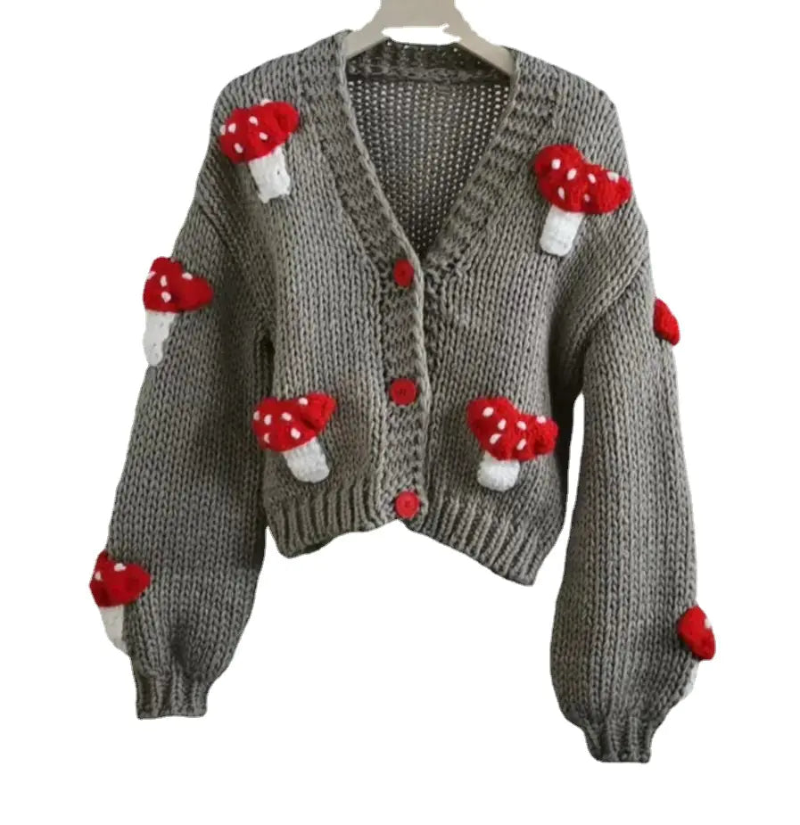 Gray knitted cardigan with red and white mushroom decorations on a white background
