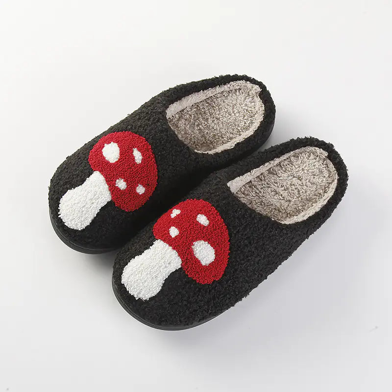 Pair of slippers with mushroom design on a light gray background