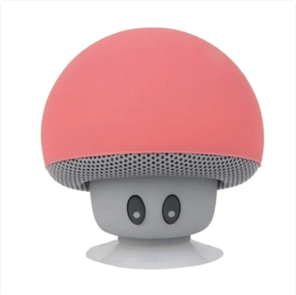 Mushroom-shaped speaker with pink top and gray bottom on a white background