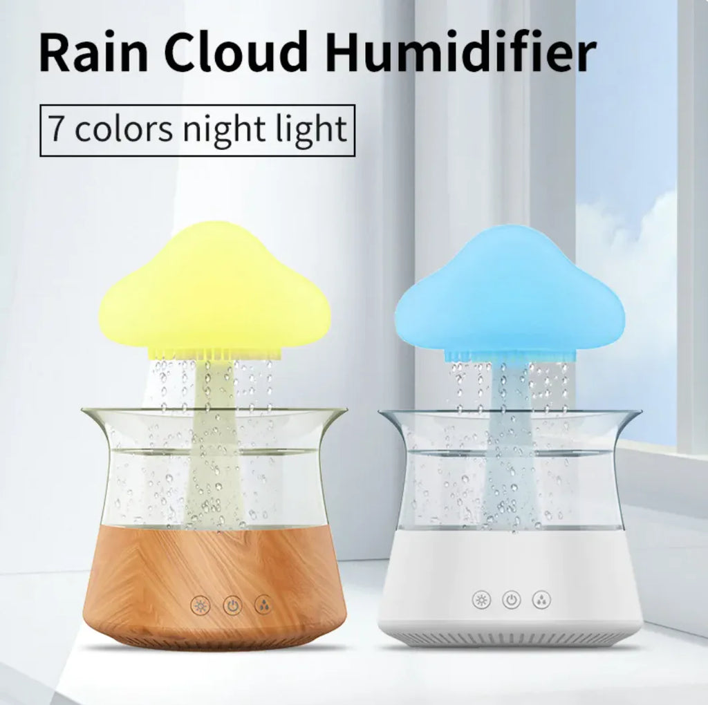 Two cloud-shaped humidifiers with colorful night lights on a light background.