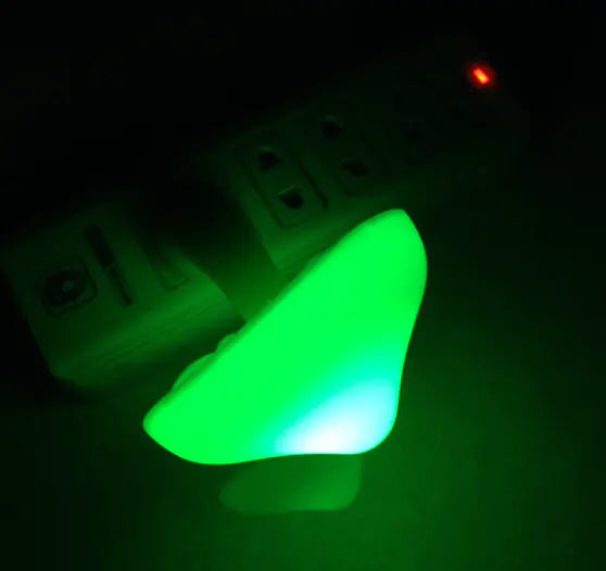 Green glowing object on a dark background