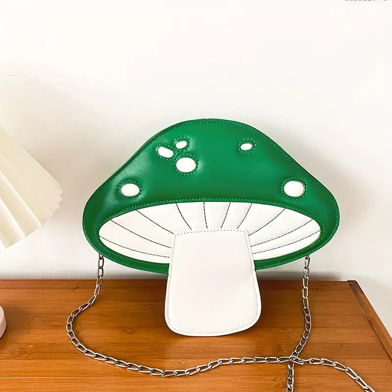 Mushroom-shaped lamp with green top and white base on a wooden surface.