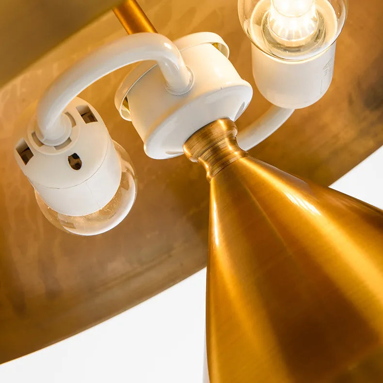 Mushroom-shaped desk lamp with warm metallic glow